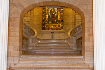 interior view of the staircase and stained glass window